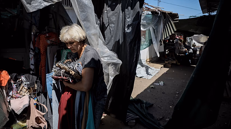 A vendor leaves a market attacked by a Russian drone in the town of Druzhkivka, Donetsk region, Ukraine, 2 August, 2025. 