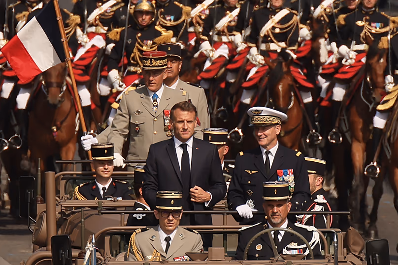 French President Emmanuel Macron arrives at the Bastille Day military parade in Paris, 14 July, 2026