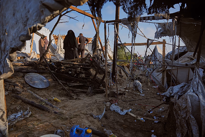 Palestinians inspect damage to their tents following an Israeli airstrike in Khan Younis, 30 June, 2026