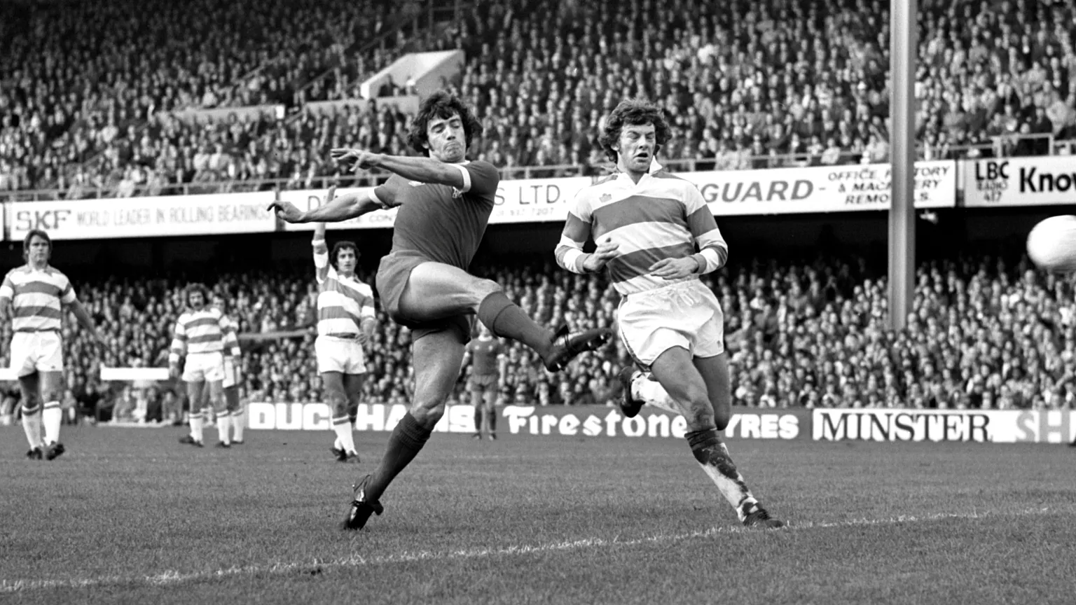 Liverpool striker Kevin Keegan shoots under pressure from QPR defender Ian Gillard during a First Division match in London on 19 October 1974. (AP Photo/Smith, File)