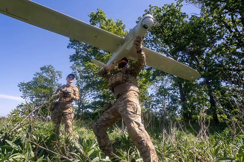 Ukrainian servicemen launch a drone towards Russian positions at the front line in the Kharkiv region, 20 May, 2026