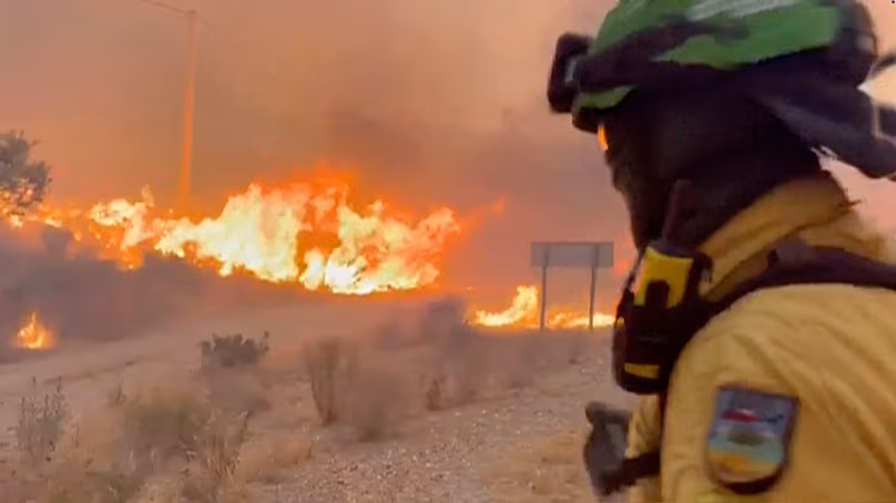 This image made from video provided by INFOCA shows firefighters battling a wildfire near Los Gallardos, 9 July, 2026