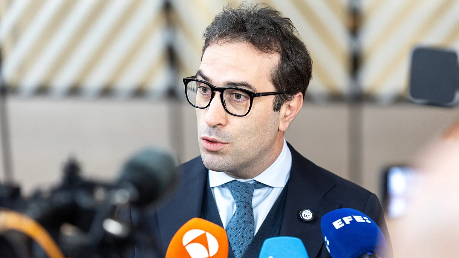 Spain's Economy Minister Carlos Cuerpo Caballero speaks with the media ahead of a Eurogroup meeting in Brussels, May 2026