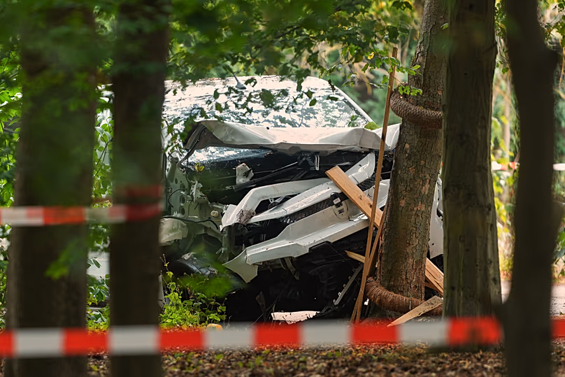 A vehicle crashed into a tree after an incident near Berlin's annual Pride event, in Berlin, Germany, Sunday, July 26, 2026.