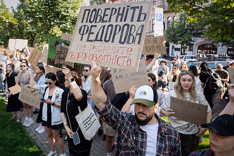 Ukranians gather to denounce Zelenskyy's decision to dismiss Mykhailo Fedorov. Placard reads: Bring back Fedorov. Do not destroy defence capability. July 16, 2026.