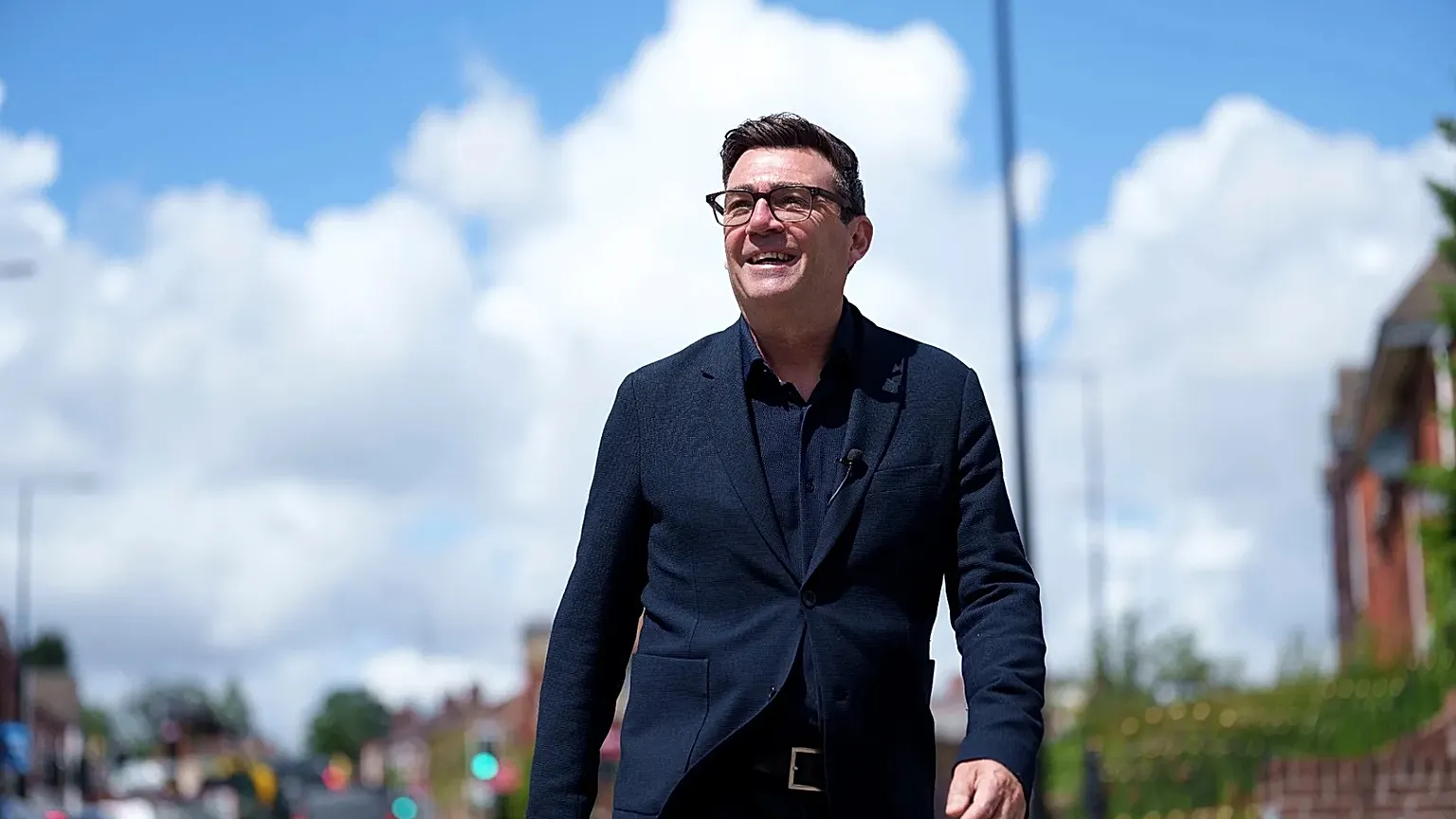 Andy Burnham smiles during a campaign visit to Ashton-in-Makerfield before the forthcoming by-election, in Manchester, England, Tuesday, June 9, 2026.