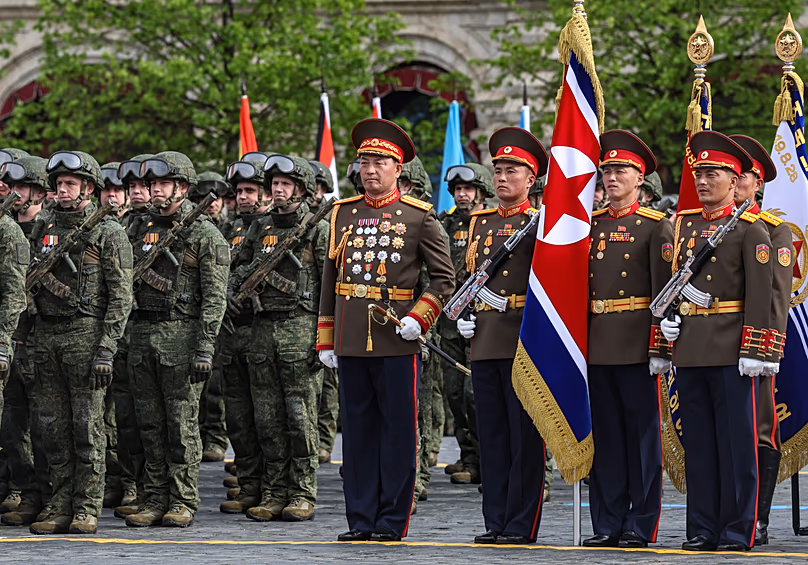 Russian, left, and North Korea's servicemen attend the Victory Day military parade in Moscow, Saturday, May 9, 2026.