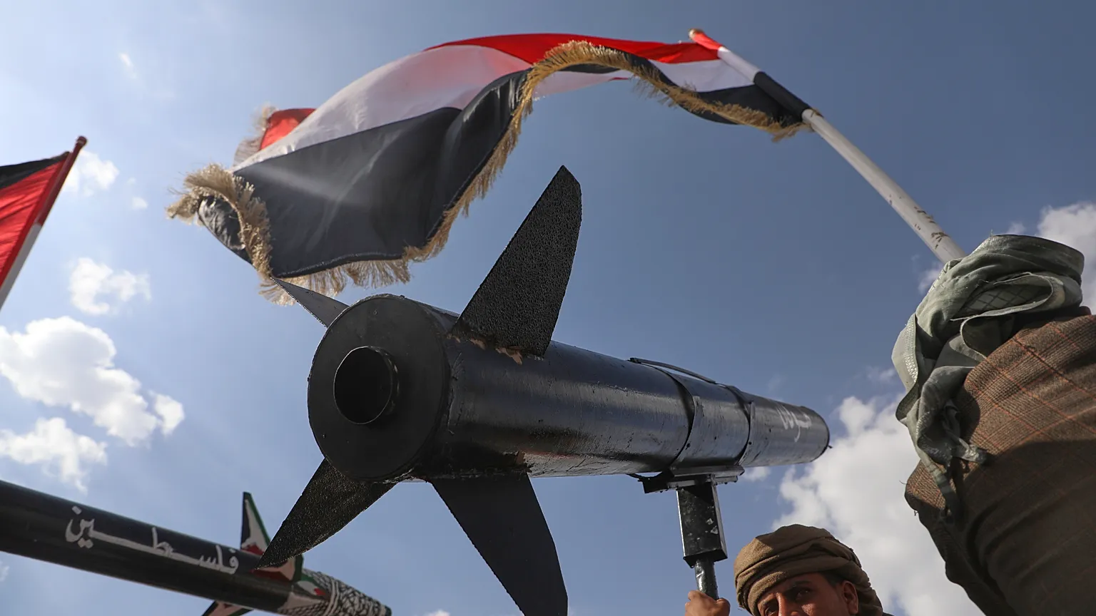 Houthi supporters demonstrate in Sanaa, carrying flags and replica missiles of the Yemeni rebels.